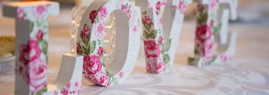 white and pink floral freestanding letter decor Photo by rovenimages.com